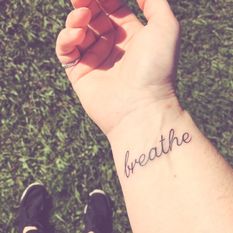 Breathe Lettering Tattoo On Right Wrist