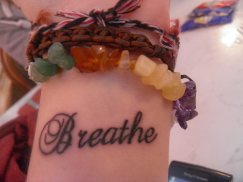 Breathe Lettering Tattoo On Wrist