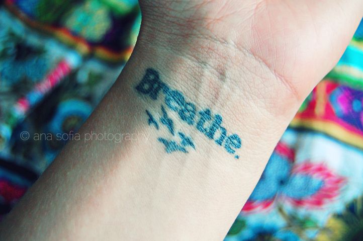 Breathe Lettering With Flying Birds Tattoo On Wrist
