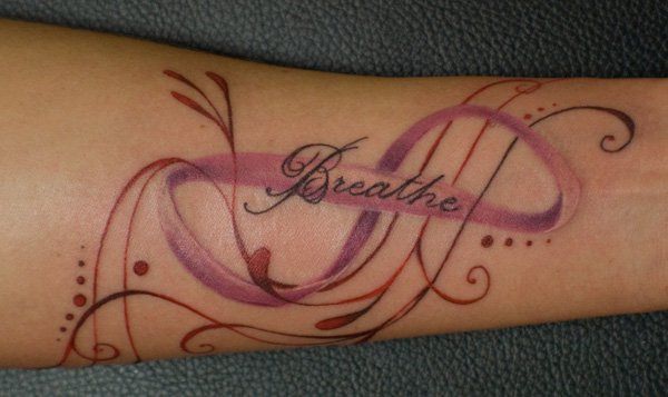 Breathe Lettering With Infinity Ribbon Tattoo Design For Forearm