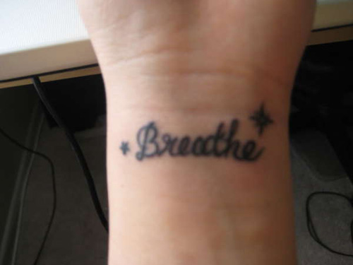 Breathe Lettering With Stars Tattoo On Wrist