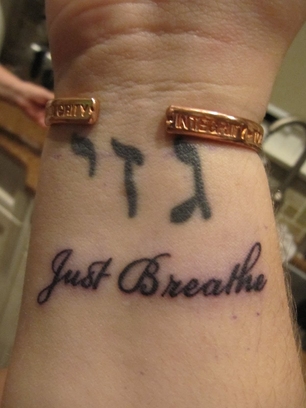 Just Breathe Lettering Tattoo Design For Right Wrist