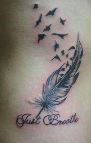 Just Breathe Lettering With Feather And Flying Birds Tattoo Design