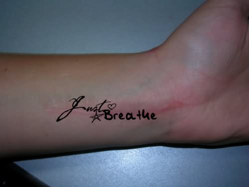 Just Breathe Lettering With Star And Heart Tattoo On Left Wrist