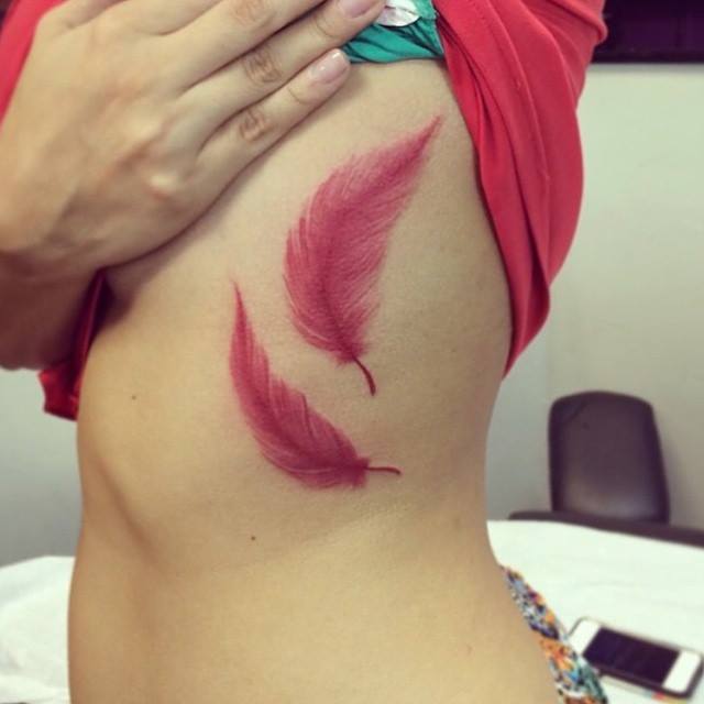 Red Feather Tattoos On Side Rib