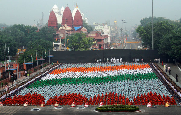 School Children In Colored Clothes Form India's Flag During The Celebration Of Independence Day At Red Fort