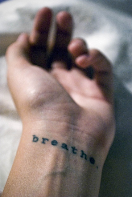 Simple Breathe Lettering Tattoo On Left Wrist