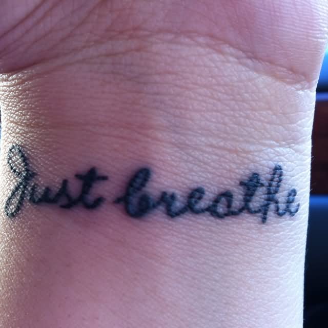Simple Just Breathe Lettering Tattoo Design For Wrist
