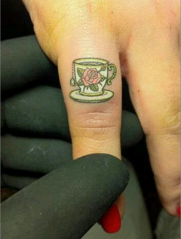 Simple Teacup Tattoo On Girl Finger