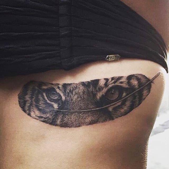 Tiger Eyes In Feather Tattoo on Side Rib