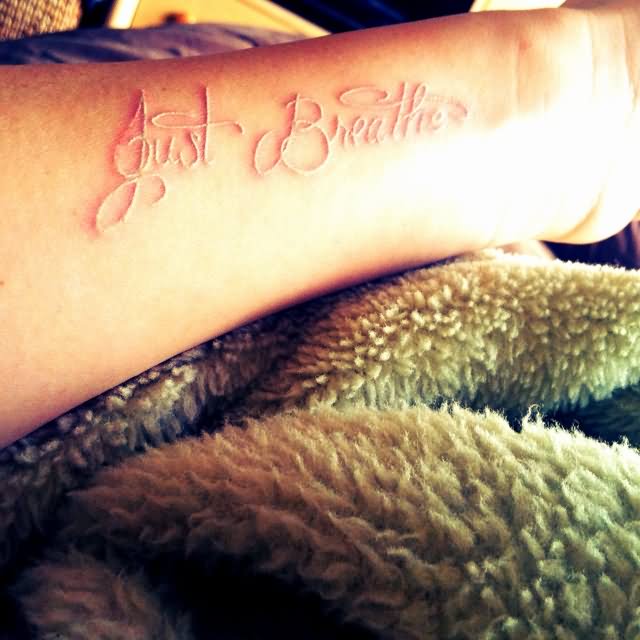 White Ink Just Breathe Lettering Tattoo On Forearm