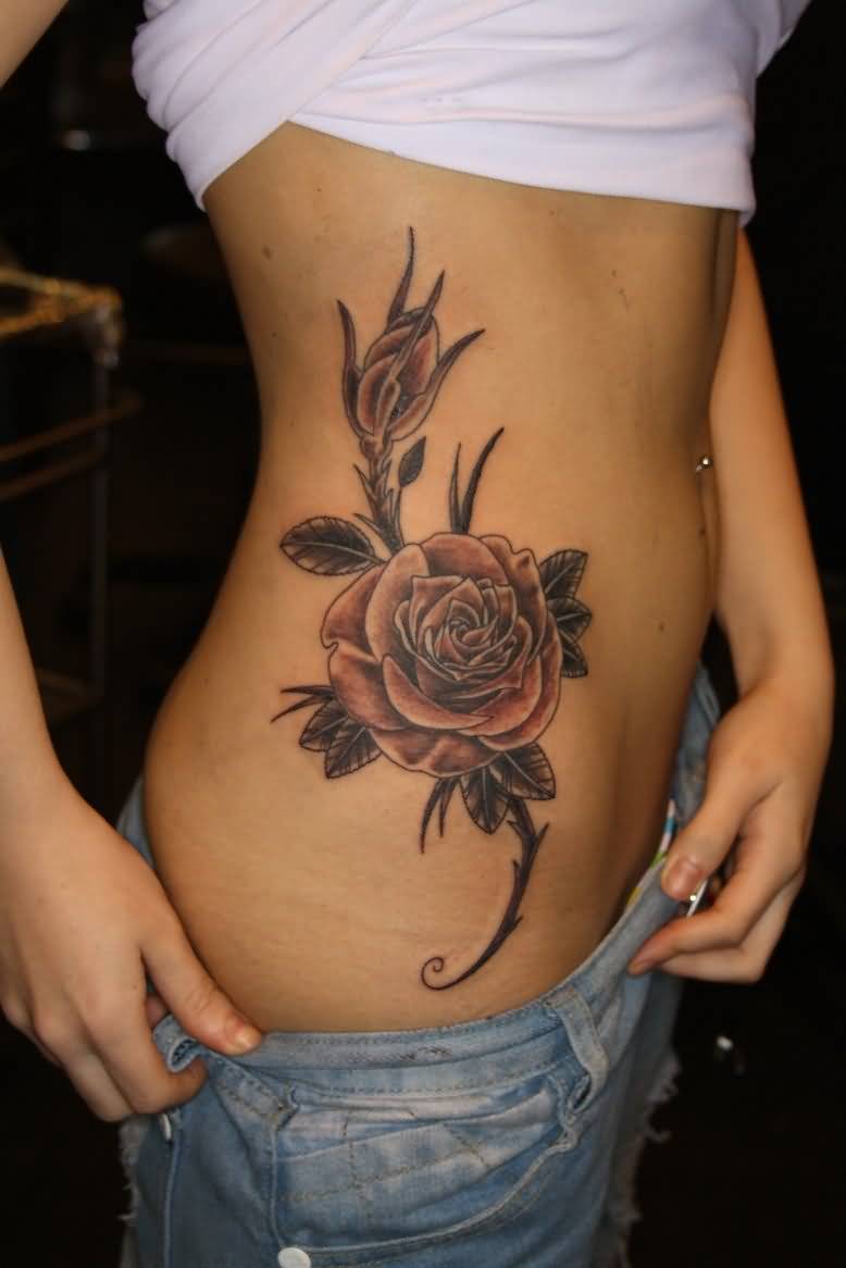 Amazing Black Ink Rose Tattoo On Girl Right Hip