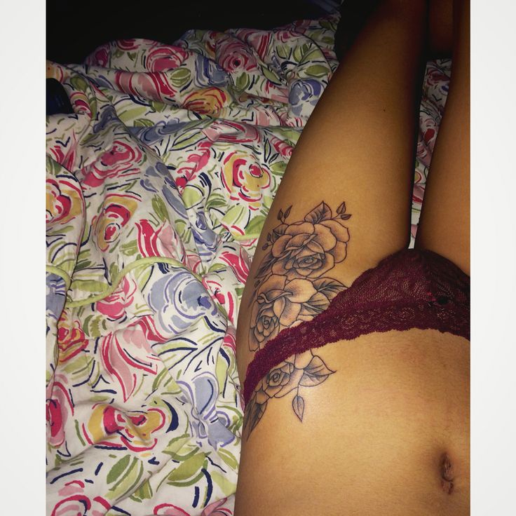 Amazing Black Ink Roses Tattoo On Girl Left Hip
