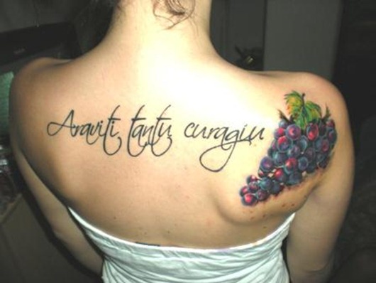 Araviti Tantu Curagiu - Colorful Grapes Tattoo On Girl Upper Back