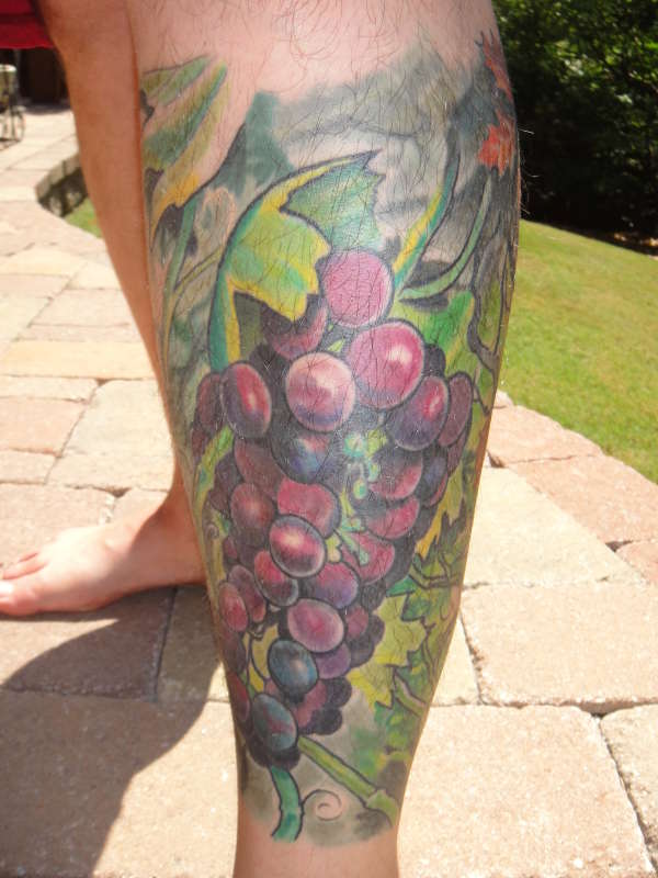 Awesome Grapes Tattoo On Left Leg