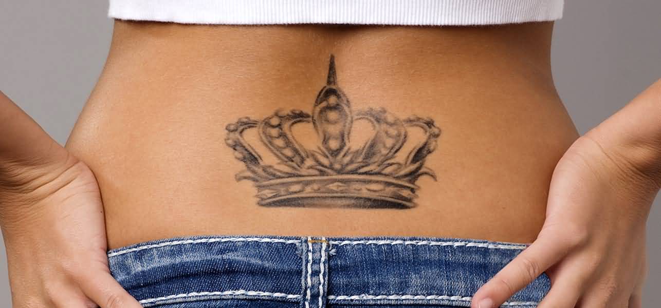 Black And Grey Crown Tattoo On Girl Lower Back