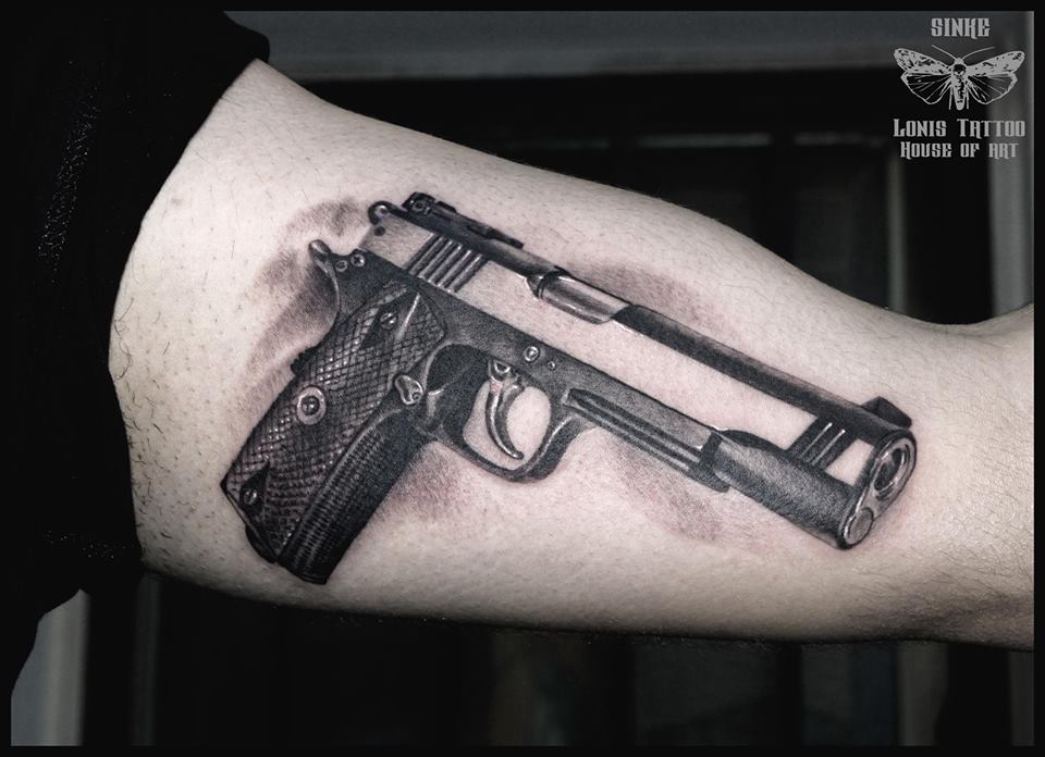 Black And Grey Gun Tattoo by Sinke