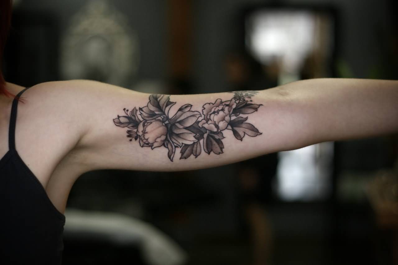 Black And Grey Peony Flowers Tattoo On Girl Left Bicep