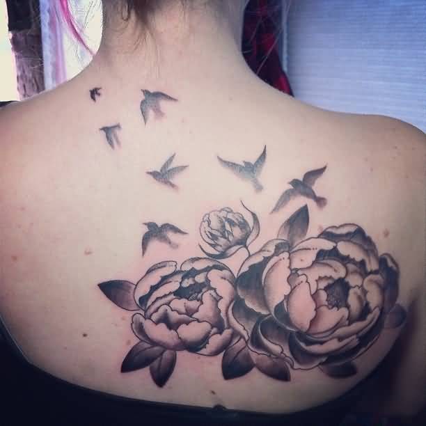 Black And Grey Peony Flowers With Flying Birds Tattoo On Upper Back