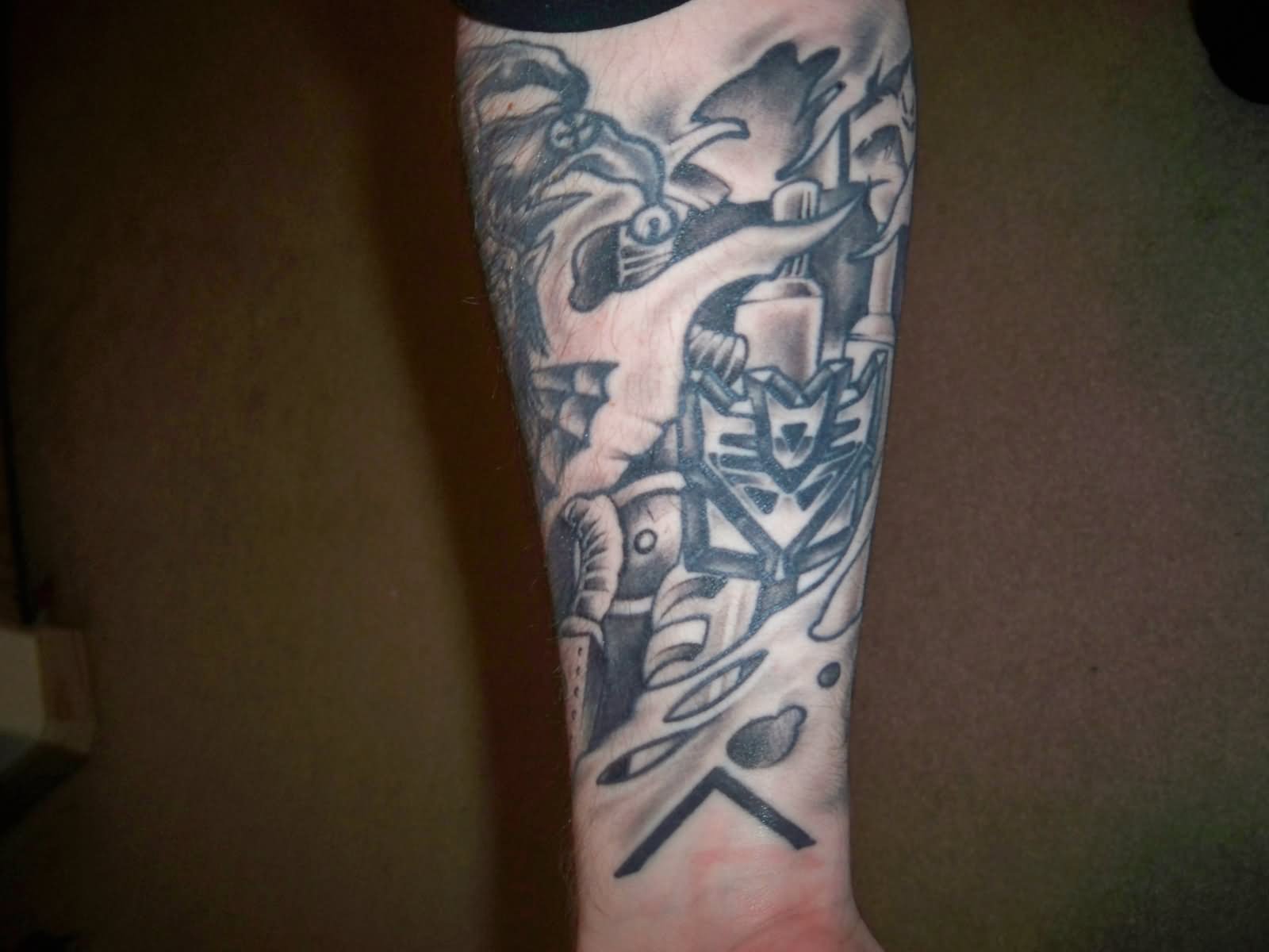 Black And Grey Ripped Skin Transformer Tattoo Design For Sleeve