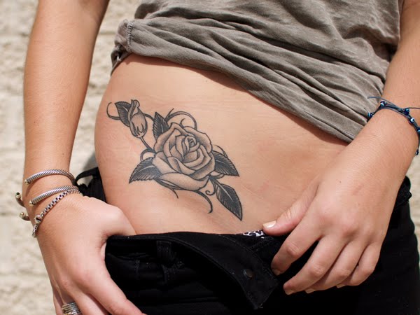 Black And Grey Rose Tattoo On Girl Right Hip