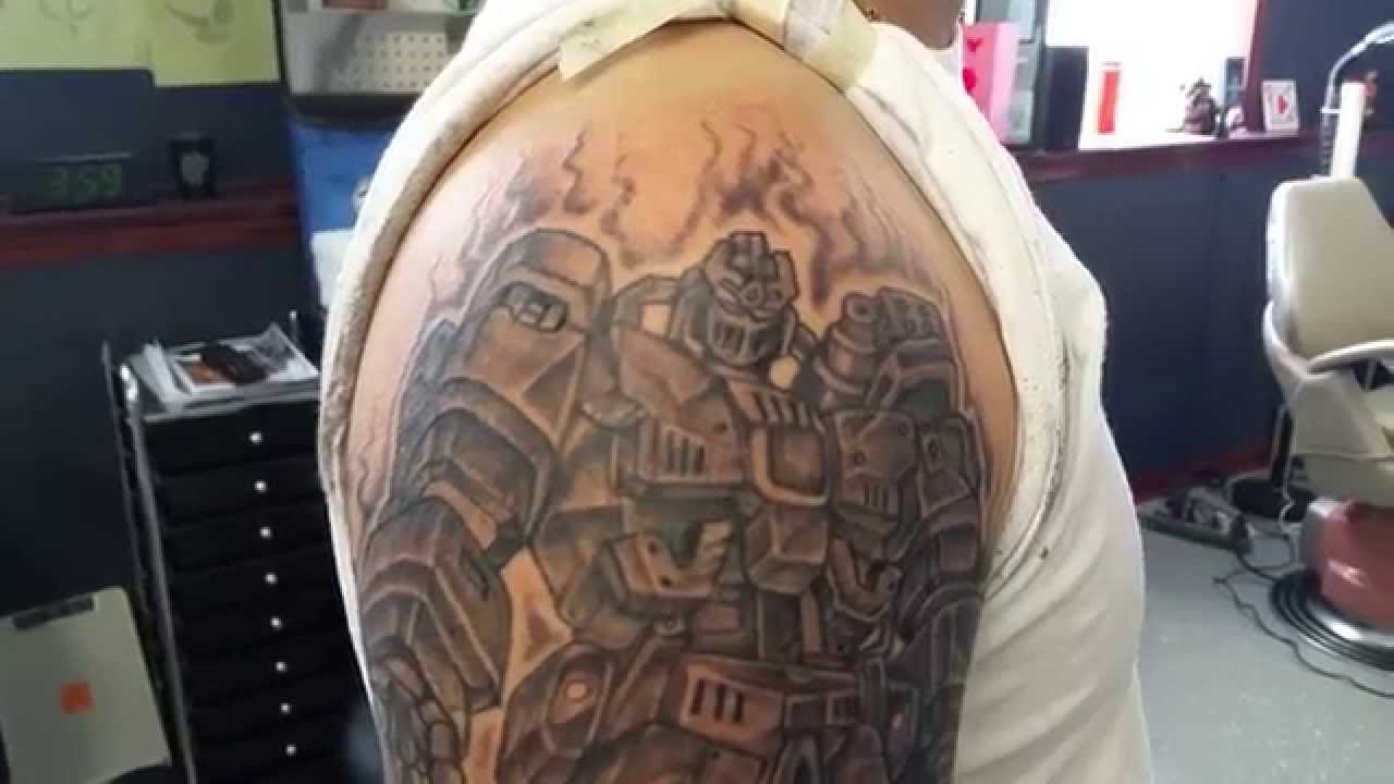 Black And Grey Transformer Tattoo On Right Shoulder