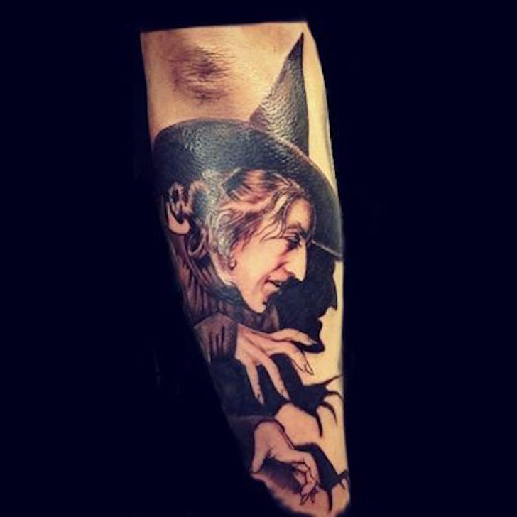 Black And White Wicked Witch Tattoo On Right Sleeve