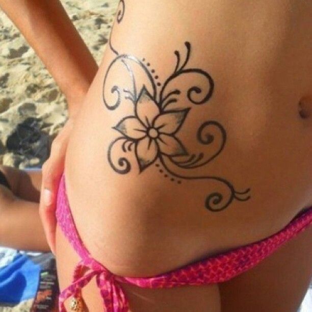 Black Flower Tattoo On Girl Right Hip
