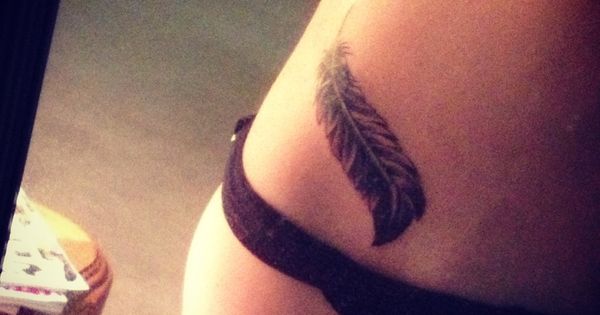 Black Ink Feather Tattoo On Right Hip