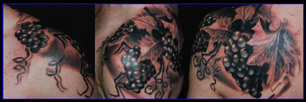 Black Ink Grapes Tattoo Design For Shoulder