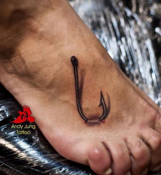 Black Ink Hook Tattoo On Right Foot