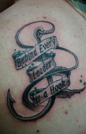 Black Ink Hook With Banner Tattoo Design For Upper Back