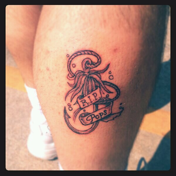 Black Ink Hook With Banner Tattoo On Right Leg Calf