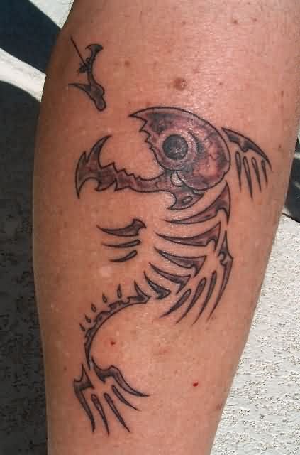 Black Ink Hook With Fish Skeleton Tattoo Design For Leg