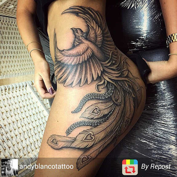 Black Ink Phoenix Tattoo On Girl Left Side Hip