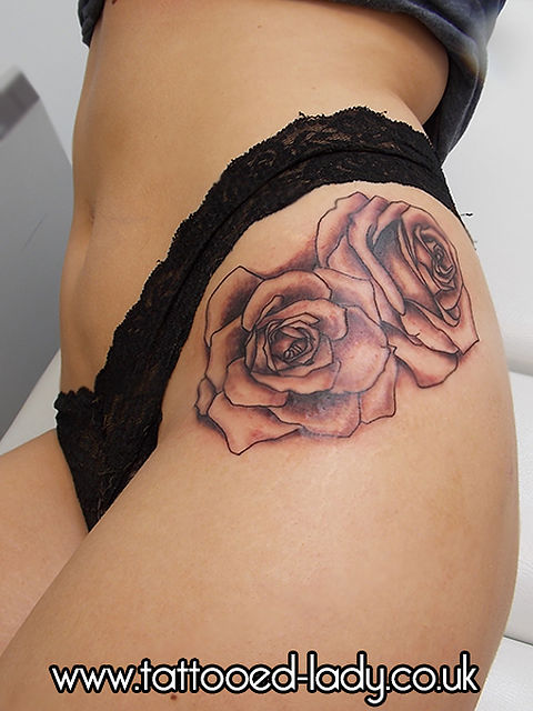 Black Ink Rose Tattoo On Girl Left Hip