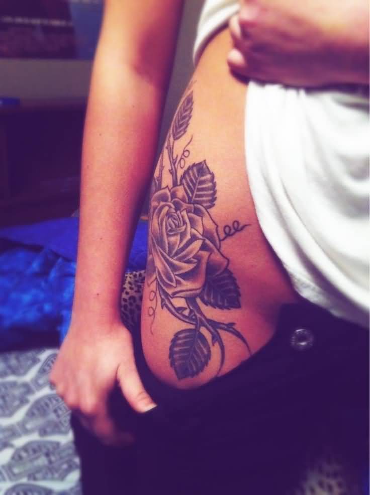 Black Ink Rose Tattoo On Girl Right Hip