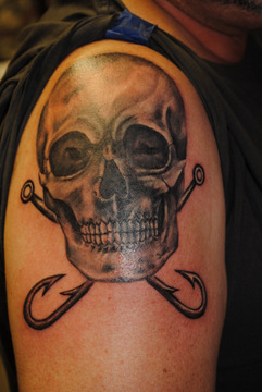 Black Ink Skull With Two Crossing Hooks Tattoo On Right Shoulder
