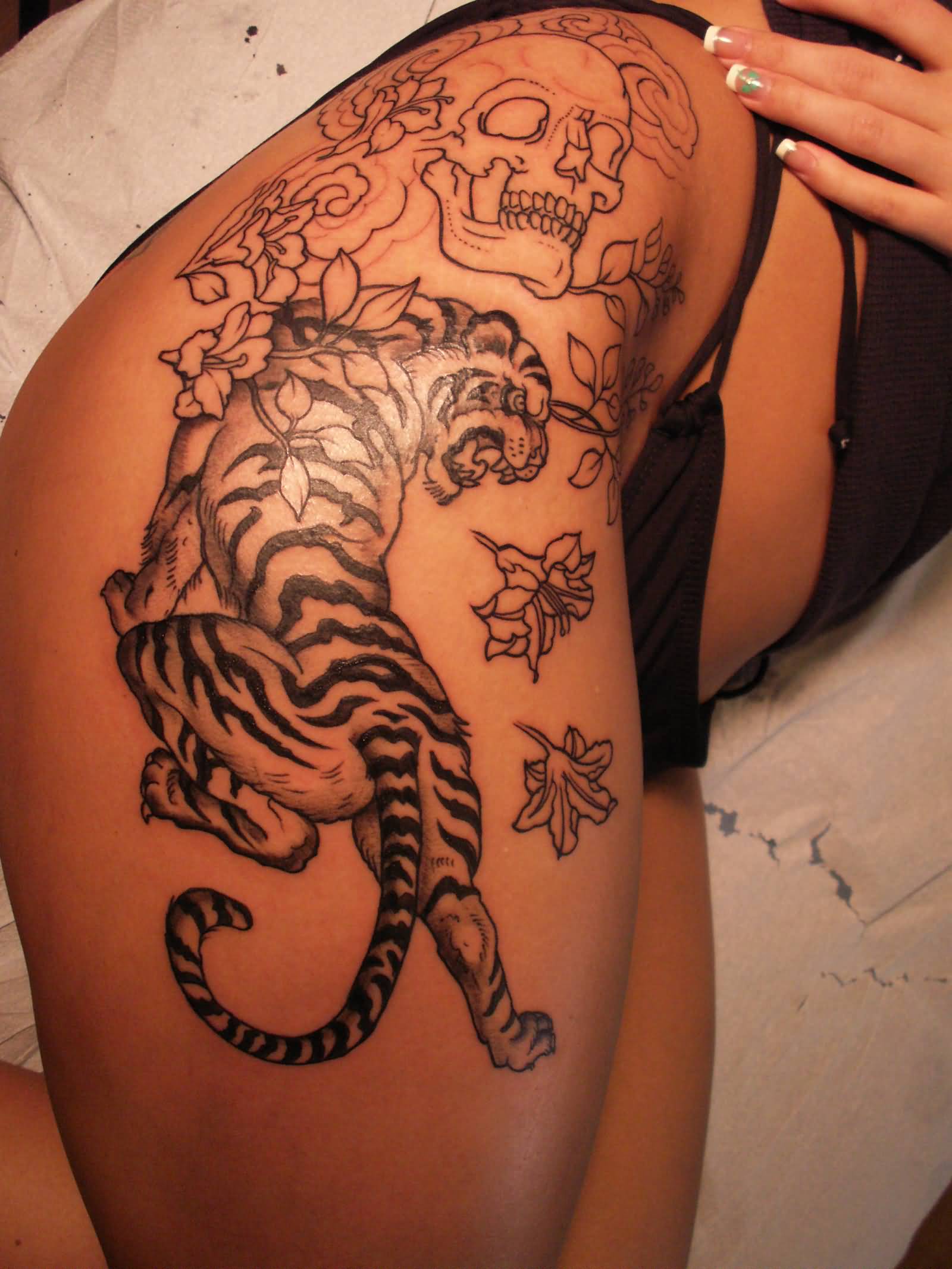 Black Ink Tiger With Skull Tattoo On Girl Right Hip