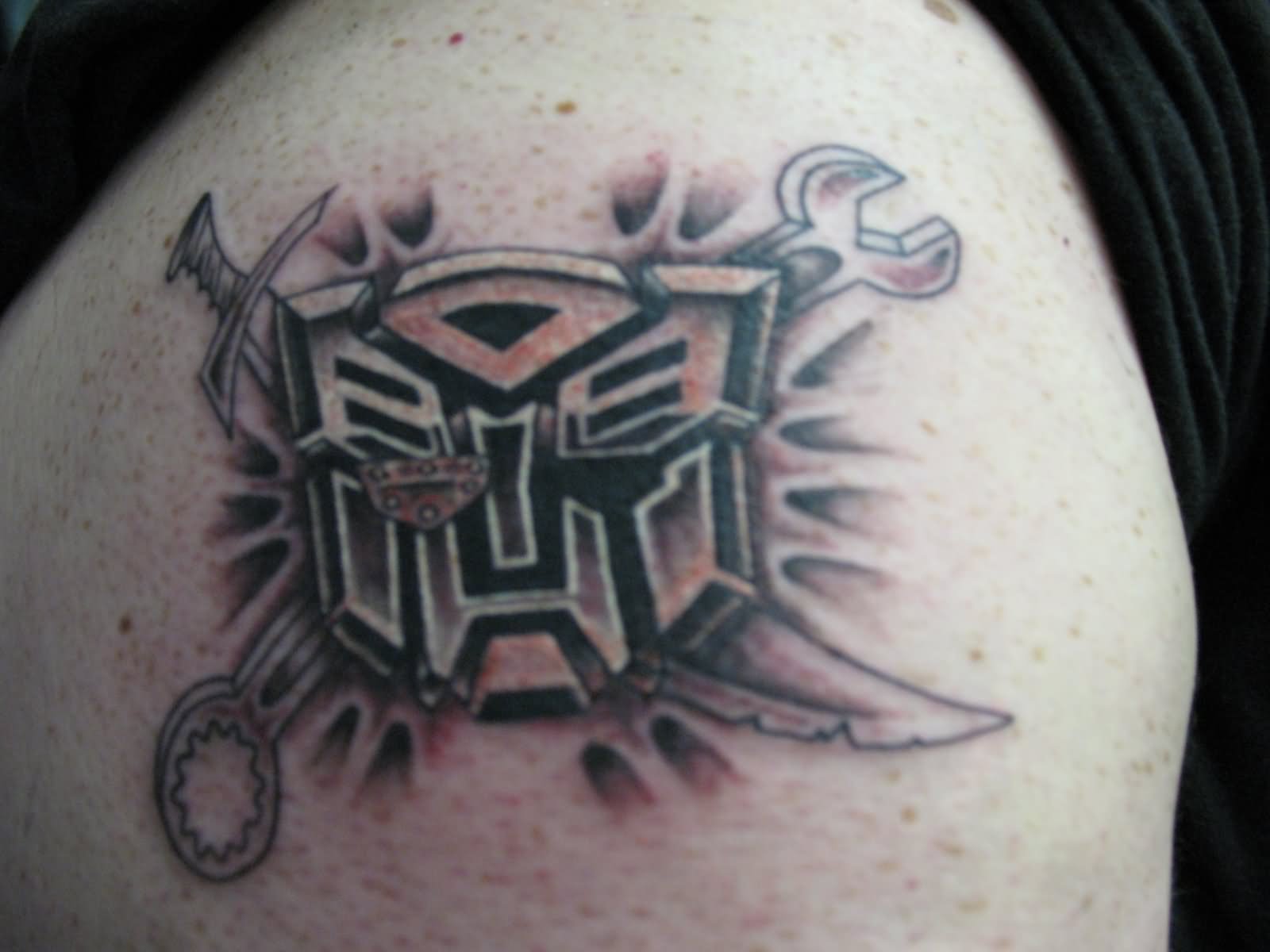 Black Ink Transformer Logo Tattoo Design