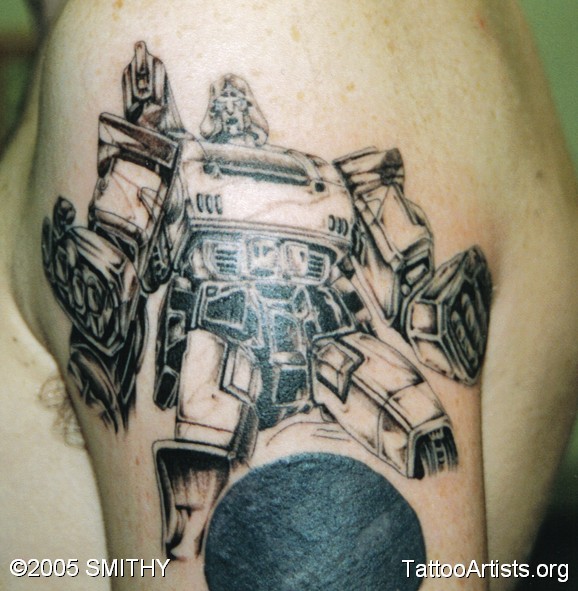 Black Ink Transformer Logo Tattoo On Left Shoulder