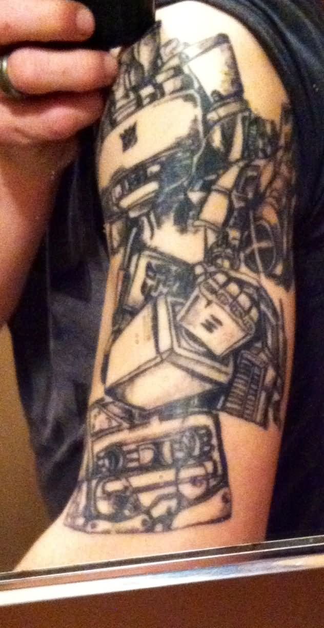 Black Ink Transformer Tattoo On Left Half Sleeve