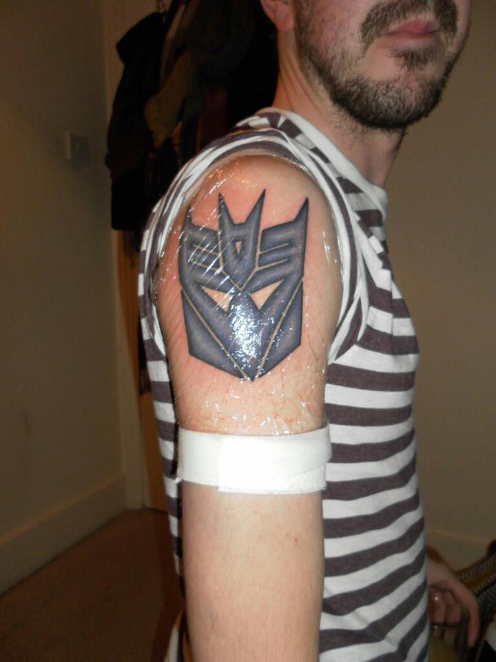 Classic Transformer Symbol Tattoo On Man Right Shoulder