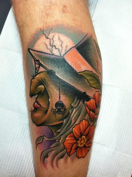 Color Flowers And Witch Face Tattoo On Leg