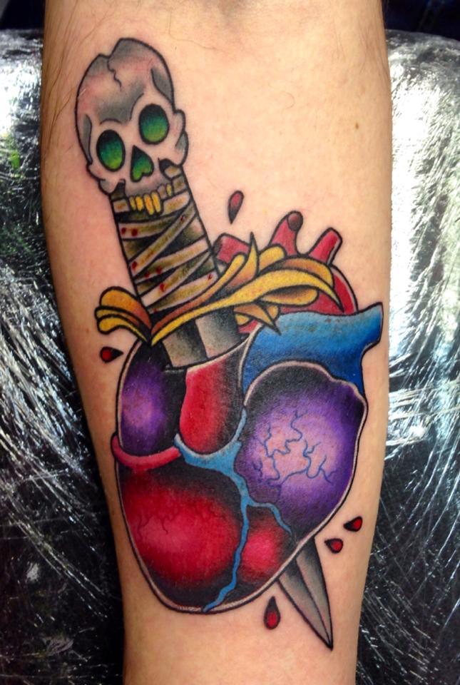 Colored Heart With Dagger Tattoo On Forearm by Holly