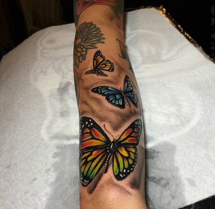 Colorful Butterflies Tattoo On Sleeve