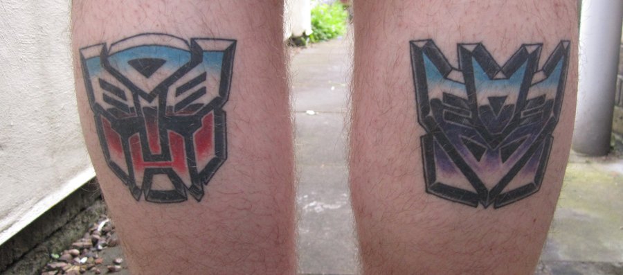 Colorful Transformer Logo Tattoo Design For Leg Calf