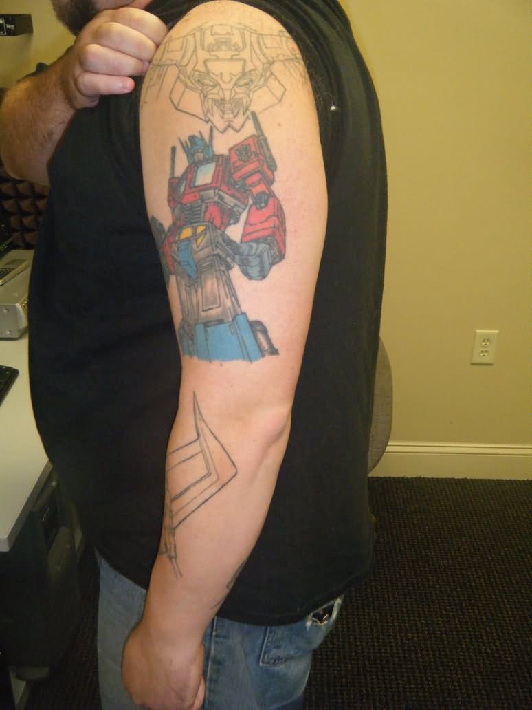 Colorful Transformer Starscream Tattoo On Left Half Sleeve By Karpy
