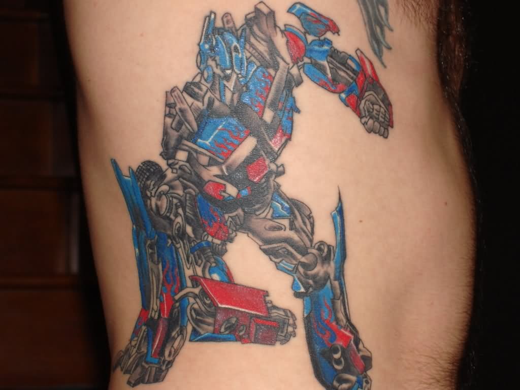 Colorful Transformer Starscream Tattoo On Side Rib