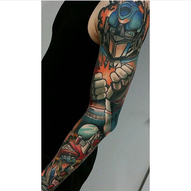 Colorful Transformer Tattoo On Left Full Sleeve